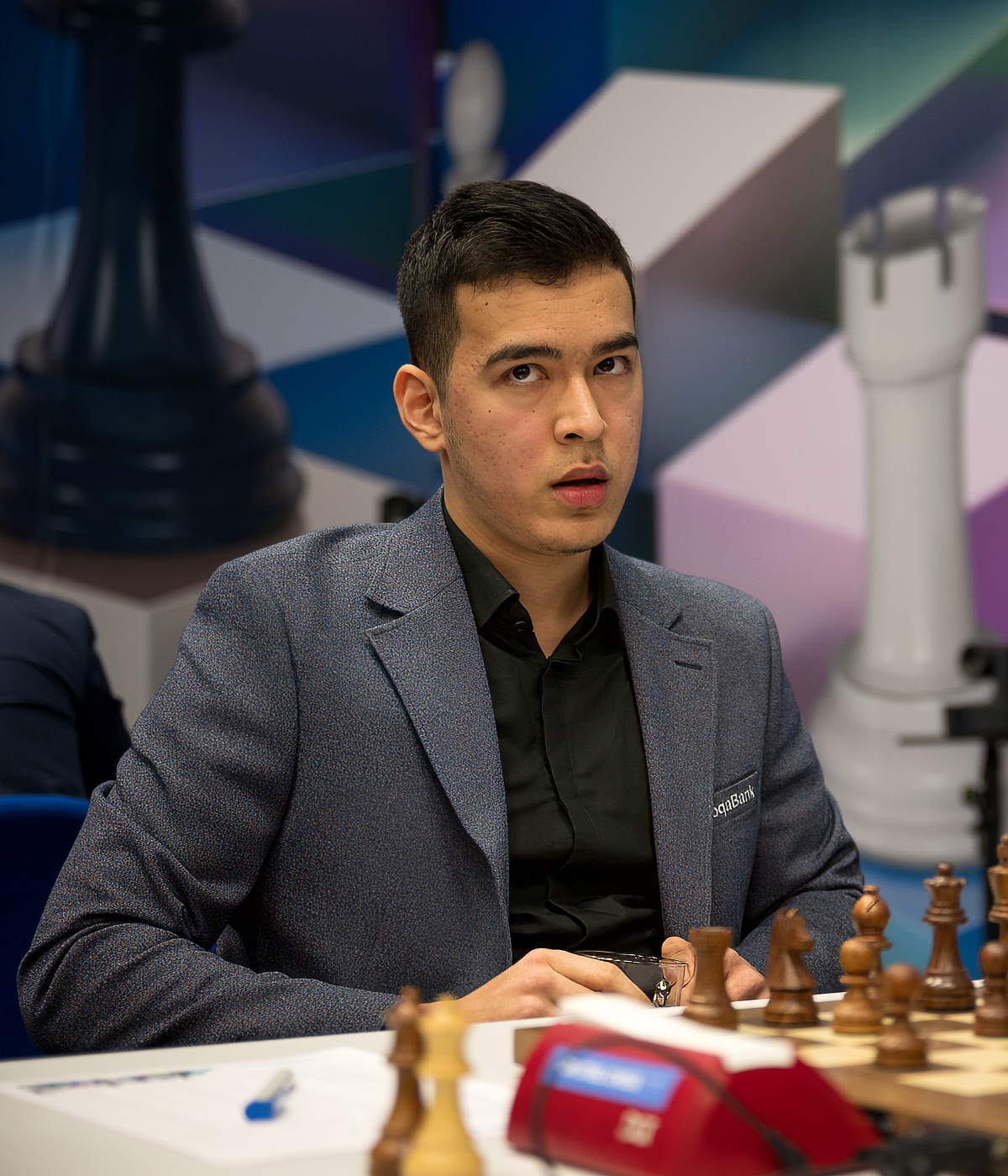Nodirbek Abdusattorov at the chessboard during a tournament